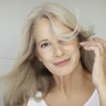 beautiful mature woman showing menopause skin care