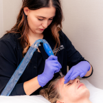 Nurse performing facial skin treatment